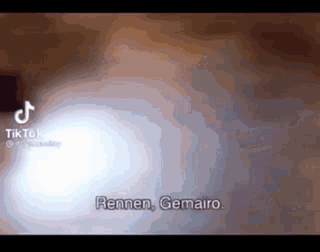a video of a person 's face with the words rennen gemairo written on it