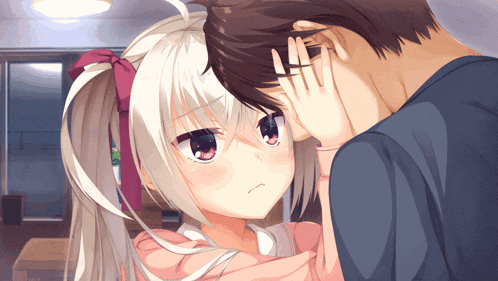 a man covering his ear with his hand while a girl looks at him