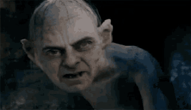 a close up of a gollum from the lord of the rings movie .