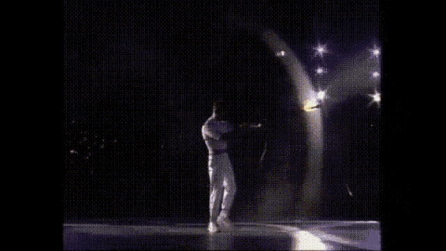 a close up of a torch with flames coming out of it against a black background .