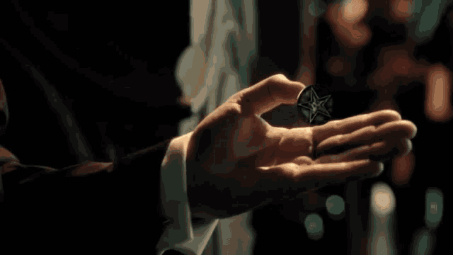 a close up of a person 's hand holding something