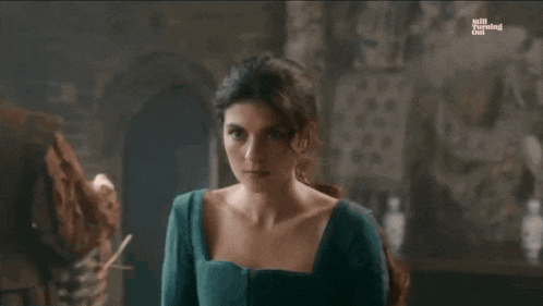 a woman in a green dress is on a screen that says ' the evening post '