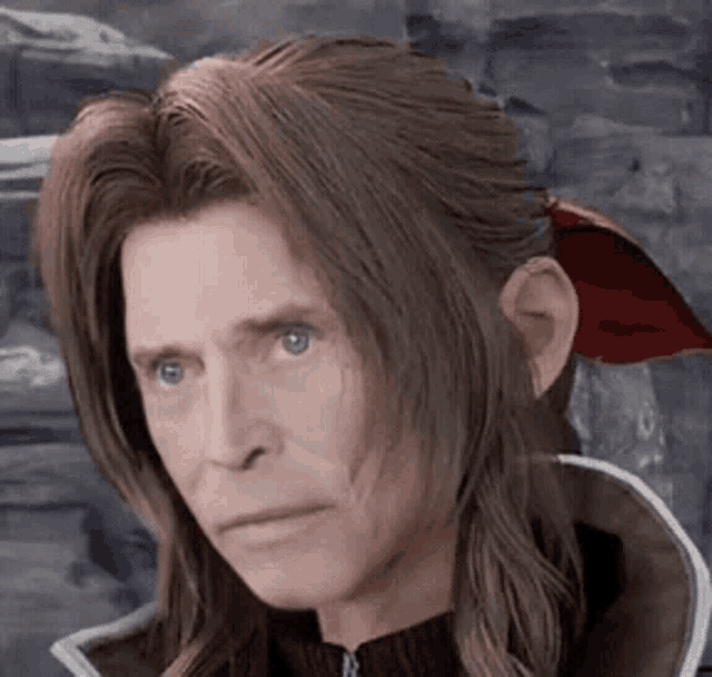 a close up of a man 's face with long hair and a red scarf around his ear .