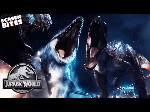 a couple of dinosaurs are fighting each other in a jurassic world movie .