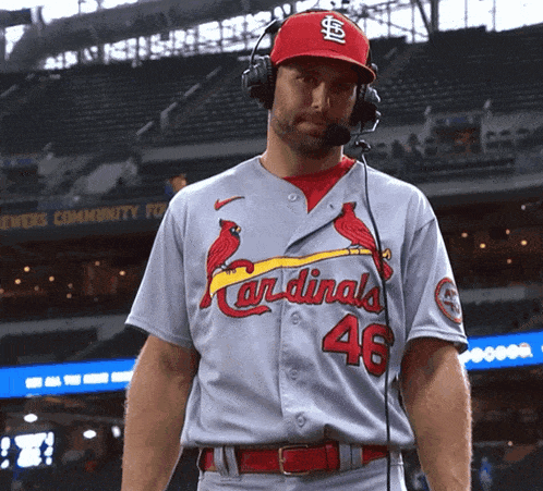 a man wearing a cardinals jersey with the number 46