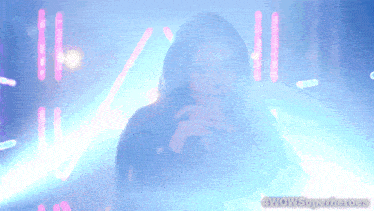 a woman in a hooded jacket with the words wowsuperheroes on the bottom left