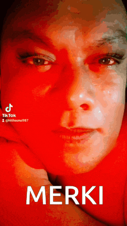 a close up of a woman 's face with the words " merki " on the bottom