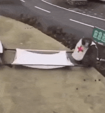 a person is being carried on a stretcher by a car .