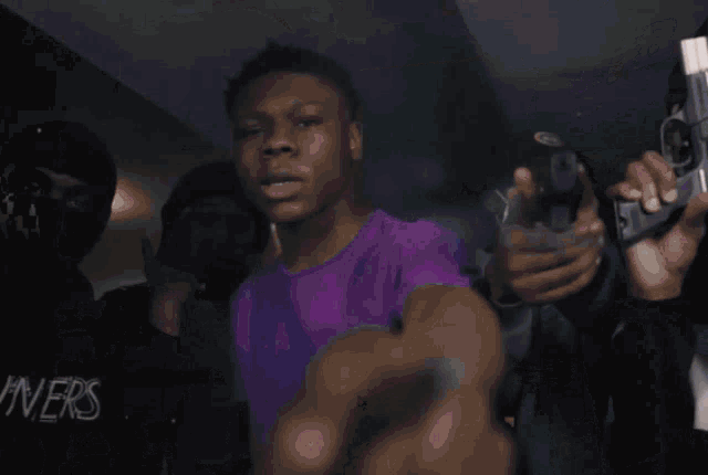 a blurry picture of a person wearing a purple shirt that says nike