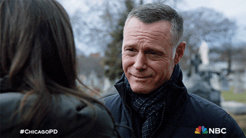 a man talking to a woman with #chicagopd written on the bottom right