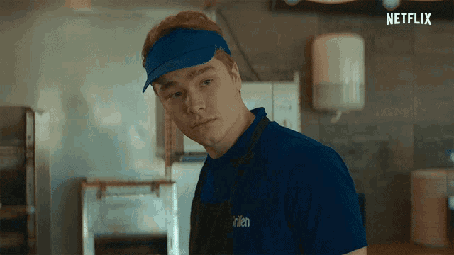 a man wearing a blue shirt that says netflix