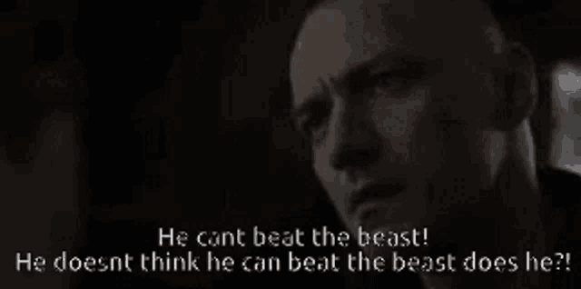 a black and white photo of a bald man with the words " he cant beat the beast " on the bottom
