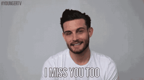 a man is smiling and saying i miss you too