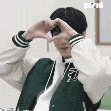 a person making a heart shape with their hands with pixid written on the bottom