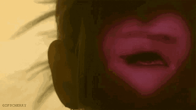 a close up of a woman 's eye with the words gifscherry on the bottom