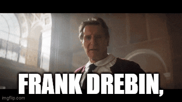 a man in a suit and tie is standing in front of a window and says frank drebin .