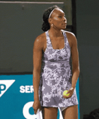 a woman in a purple dress is holding a tennis ball and a racquet