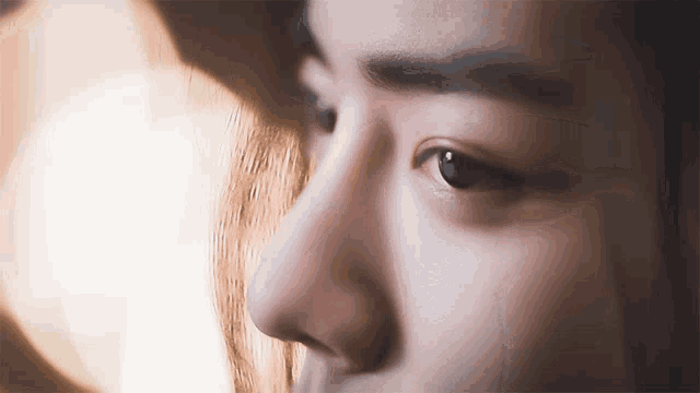 a close up of a person 's eye with a shadow on it