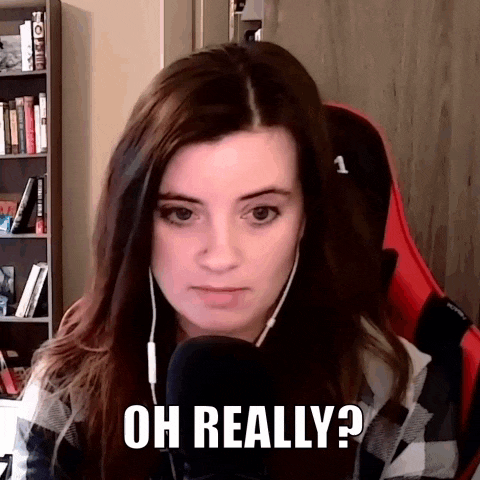 a woman wearing headphones is sitting in front of a microphone and says " oh really " .