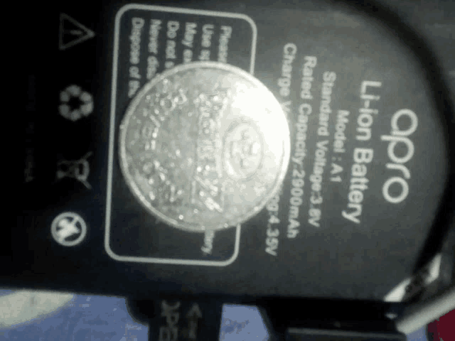 an oppo li-ion battery with a coin on top