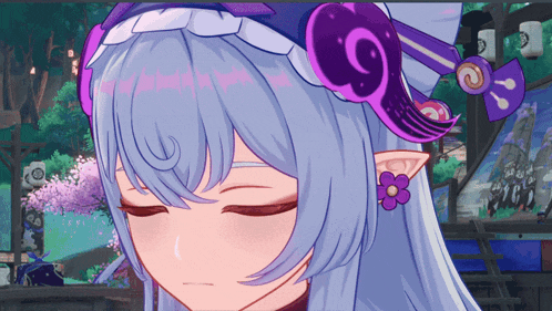 a close up of a girl 's face with a flower in her hair