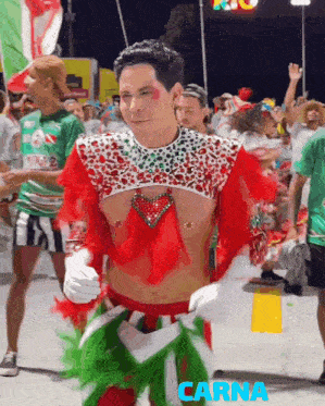 a man in a red white and green costume with the word carna in blue