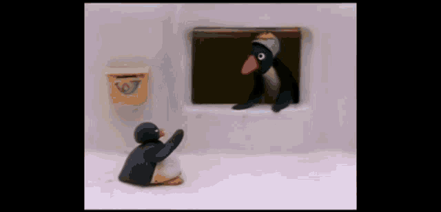two penguins are standing next to each other in front of a mailbox with the letter p on it