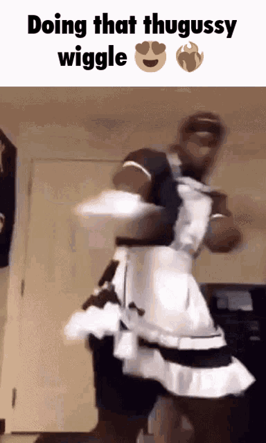 a man dressed as a maid is doing a wiggle