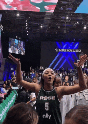 a female basketball player wearing a jersey that says rose 5 ally