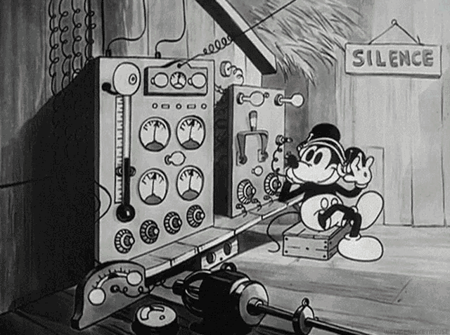 a black and white cartoon of mickey mouse talking on a phone with a sign that says silence