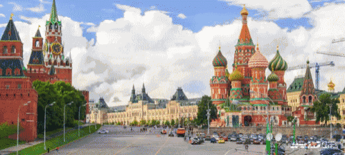 a pixelated image of a city with a clock tower and a church