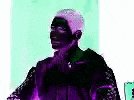 a man in a purple jacket is standing in front of a green and purple background .