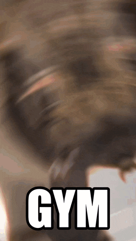 a blurred image of a person with the word gym in white
