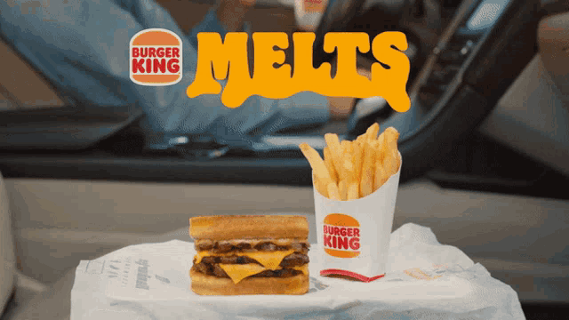 a burger king advertisement with a hamburger and fries