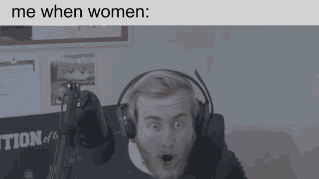 a man wearing headphones is sitting in front of a microphone with the caption " me when women "