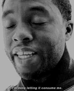 a black and white photo of a man with his eyes closed .