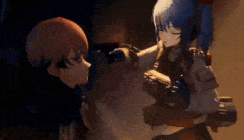 a boy and a girl are standing next to each other in a dark room .