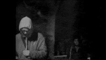 a black and white photo of a man and a woman .