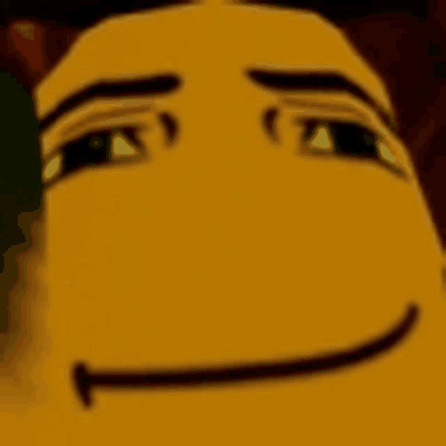 a close up of a yellow cartoon character 's face with a smile on his face .