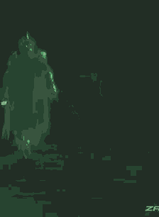 a person is standing in the dark with a green light behind them .