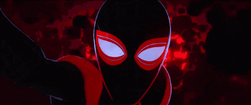 a close up of a cartoon character 's face with glowing eyes against a red background .