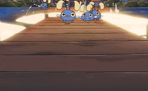 a bunch of blue cartoon characters are on a wooden dock