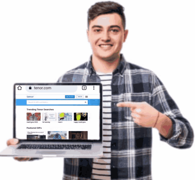a man in a plaid shirt is holding a laptop and pointing at the screen