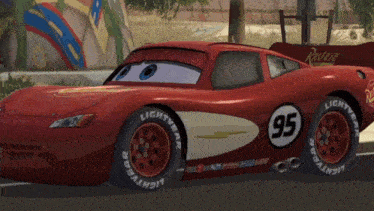 a red lightning mcqueen race car with the number 95 on it