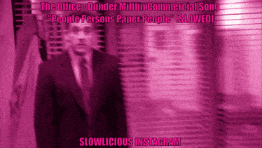 a blurred image of a man in a suit and tie with the words slowlicious instagram below him