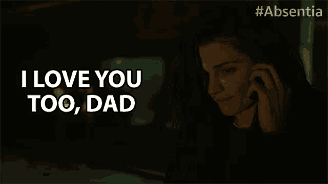 a woman talking on a cell phone with the words i love you too dad behind her