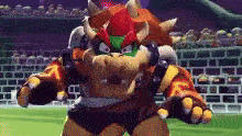 a cartoon character with horns is standing on a field in front of a brick wall .