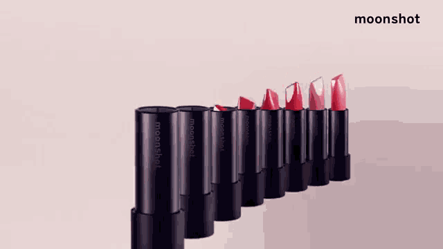 a row of moonshot lipsticks are lined up
