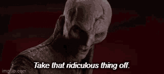 a man with a bald head is saying `` take that ridiculous thing off . ''