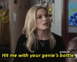 a woman in a black shirt says hit me with your genie 's bottle